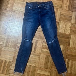 Joes womens distressed, ripped blue jeans.